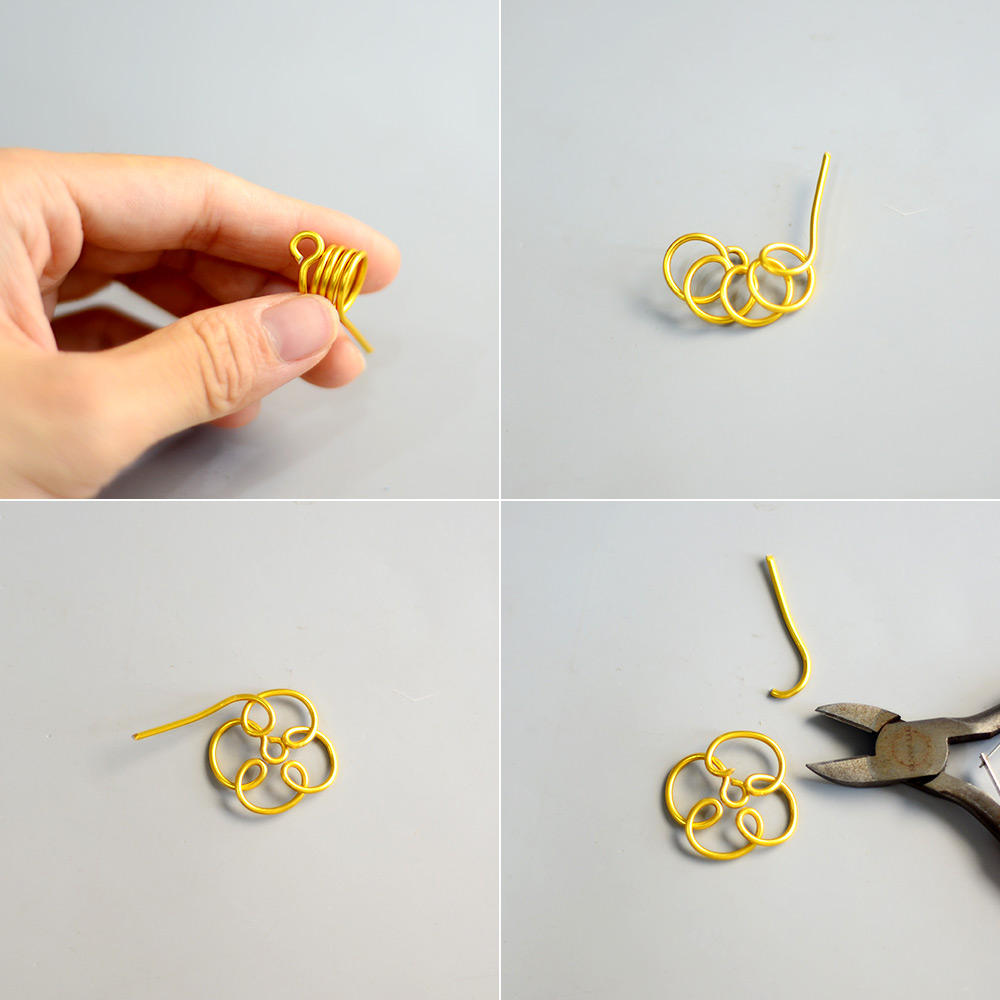 Goldene, mit Draht umwickelte Blumenohrringe