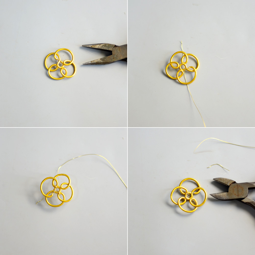 Goldene, mit Draht umwickelte Blumenohrringe
