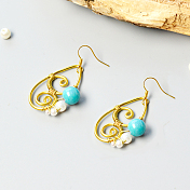 Boucles d'oreilles pendantes enveloppées de fil et décorées de perles de jade