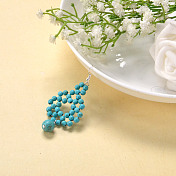 Boucle d'oreille fantaisie avec perles synthétiques turquoise