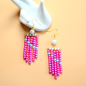 Elegantes pendientes de perlas rosas