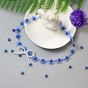 Gargantilla con lazo de perlas azules