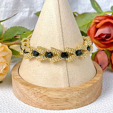Bracelet en perles de verre noir et doré