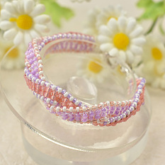 Bracelet perlé de graines roses et violettes