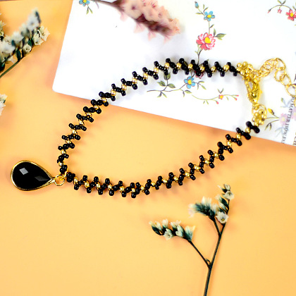 Bracelet de cheville en perles noires et dorées-8