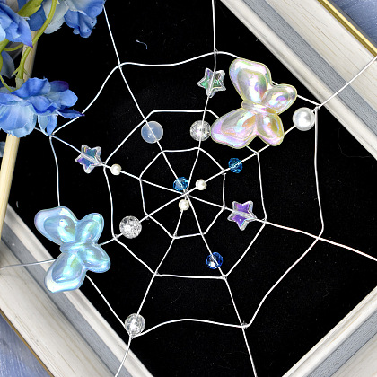 Spinnennetz-Ornament aus Kupferdraht